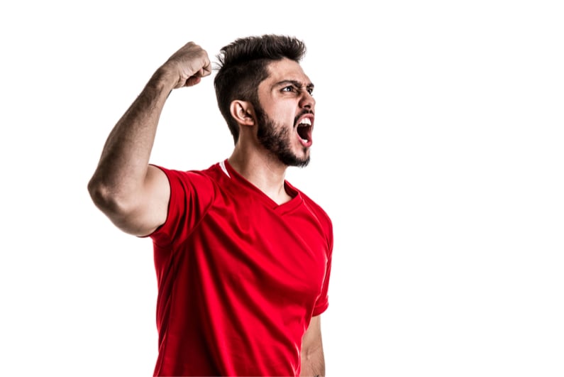 Fan/Sport Player in red uniform celebrating on white background