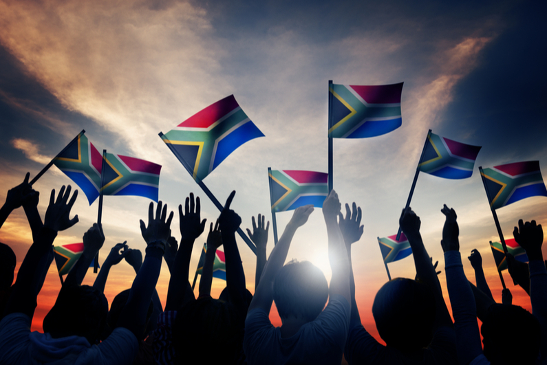 Group of People Waving South African Flags