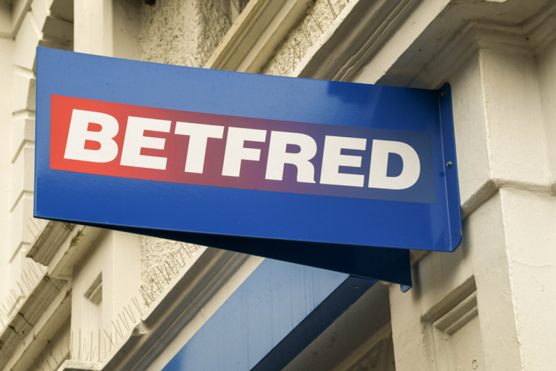 sign above the entrance to a Betfred betting shop