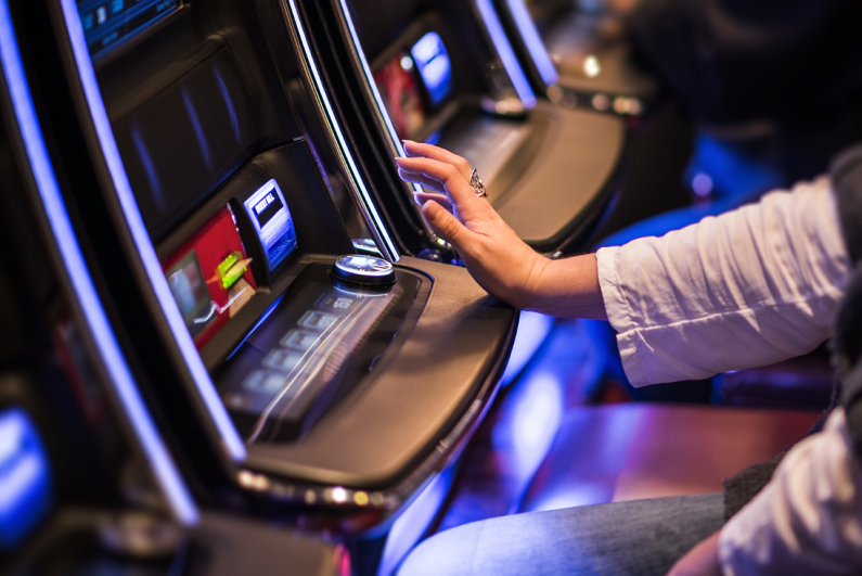 female using a gambling machine