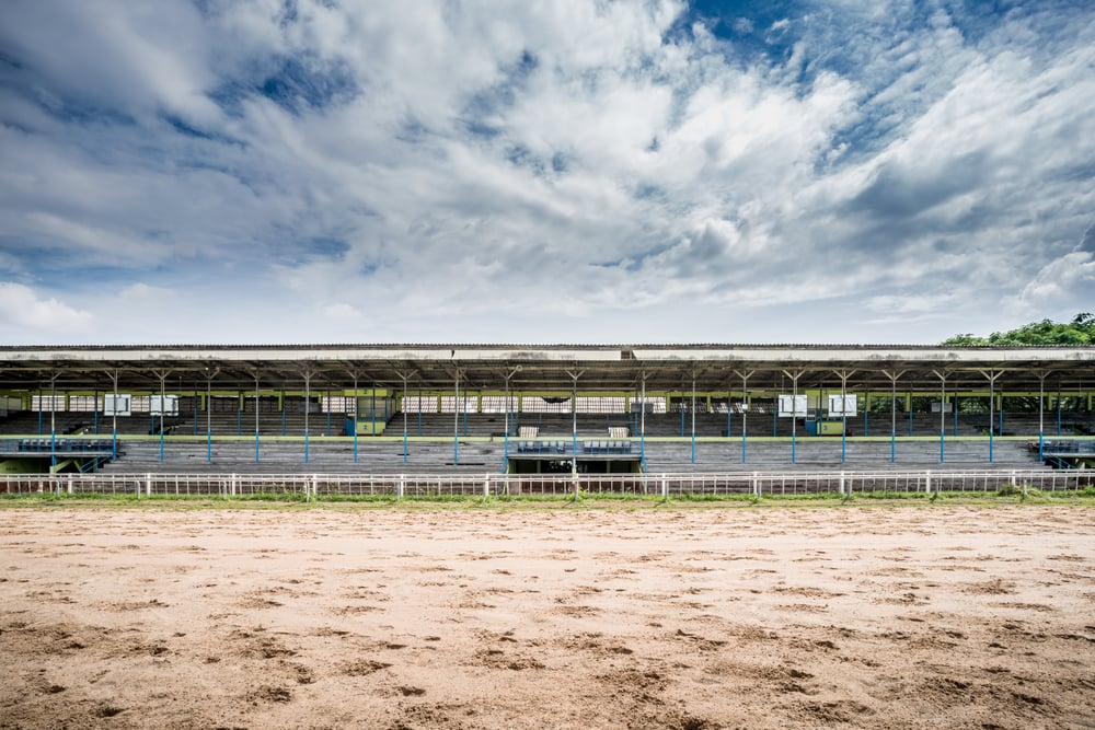 racecourse track with wooden grandstand