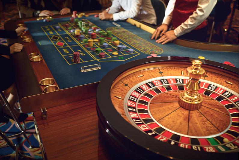 People gambling at a roulette table