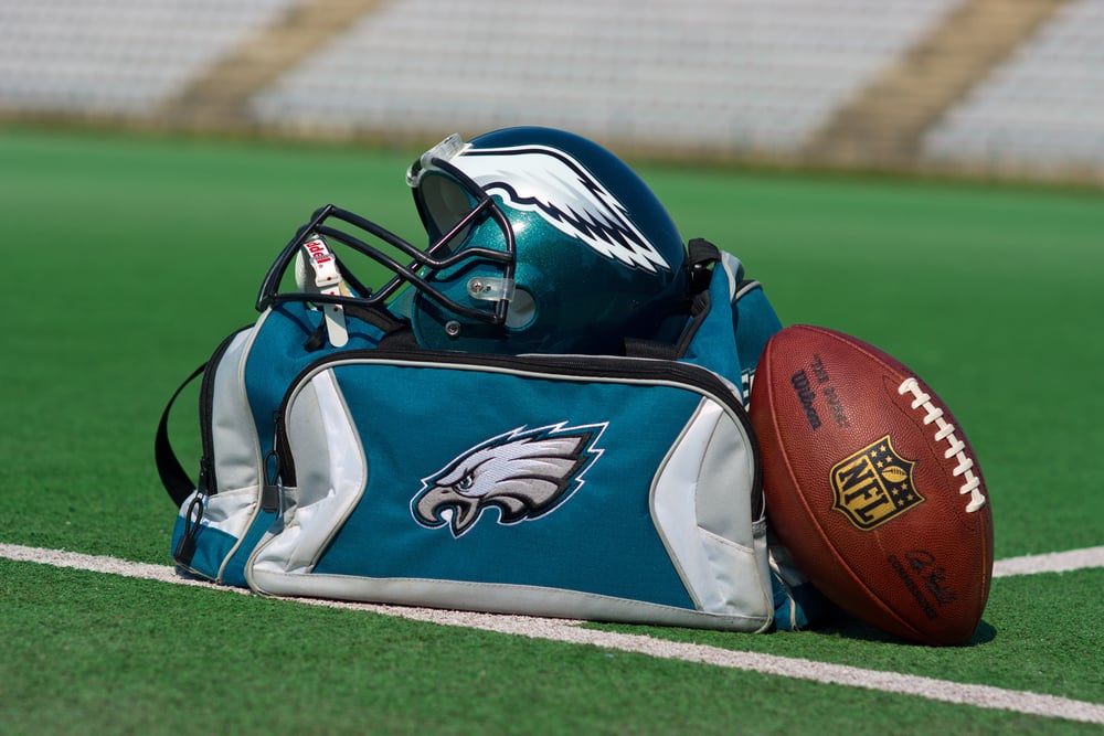 Philadelphia Eagles sports gear and football on pitch