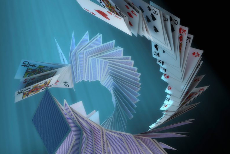 cards falling in spiral formation