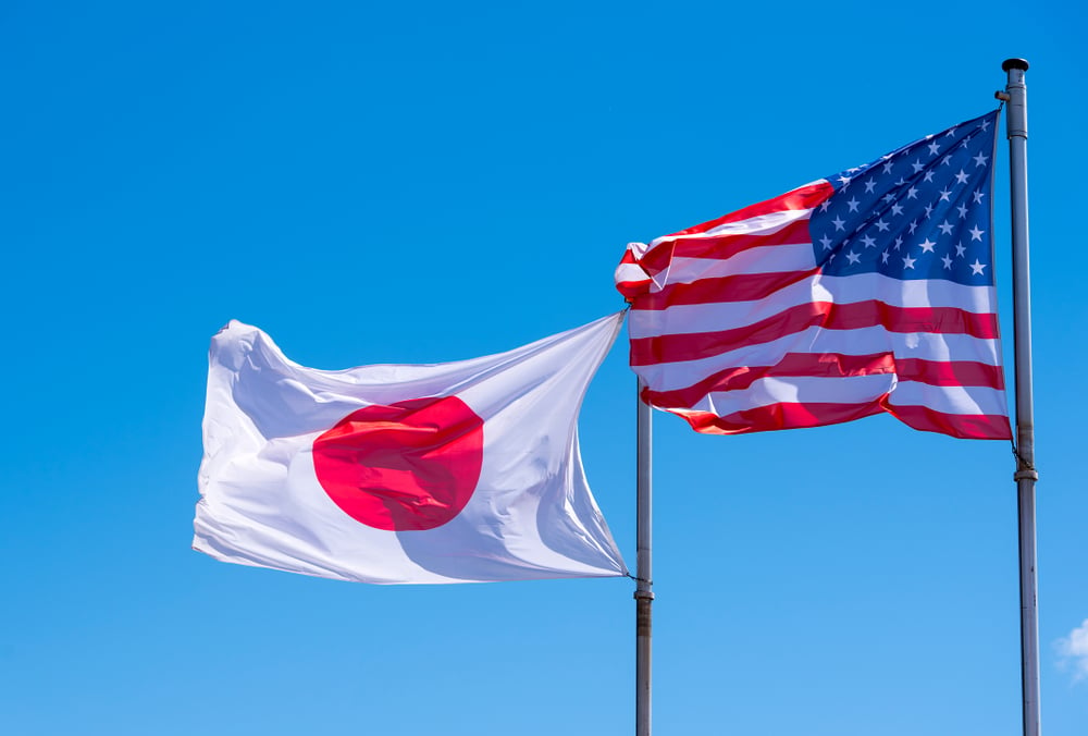 flag of Japan next to a US flag on masts