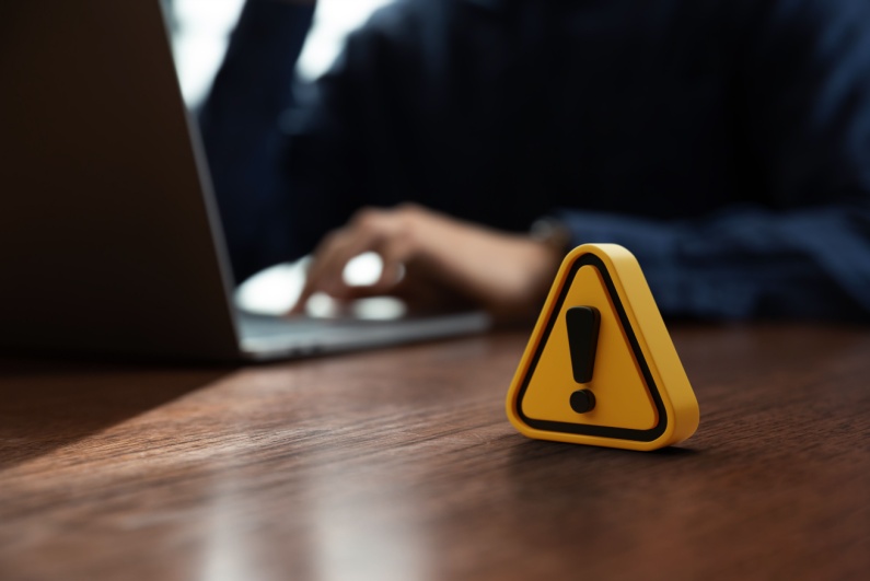 warning symbol on a desk